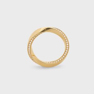 Celine Torsion Ring in Brass and Diamonds Gold